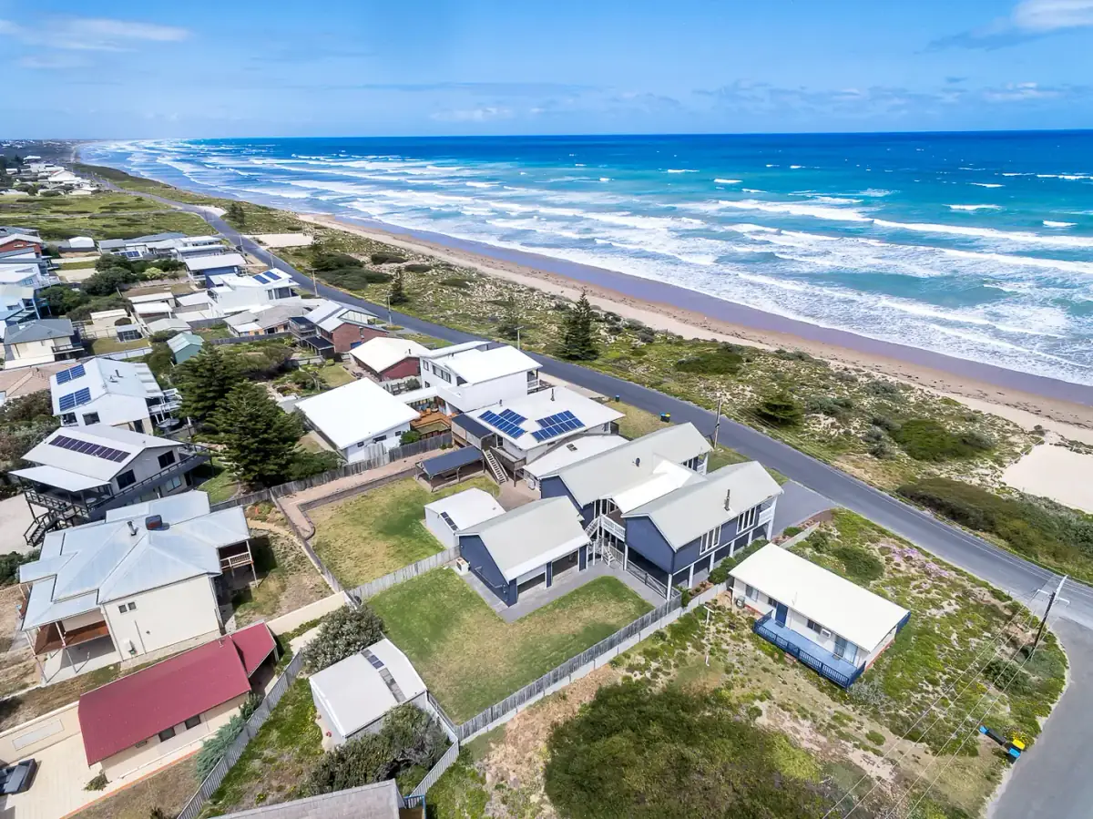 Aerial real estate photo of a coastal street, shot by the founder on a real listing