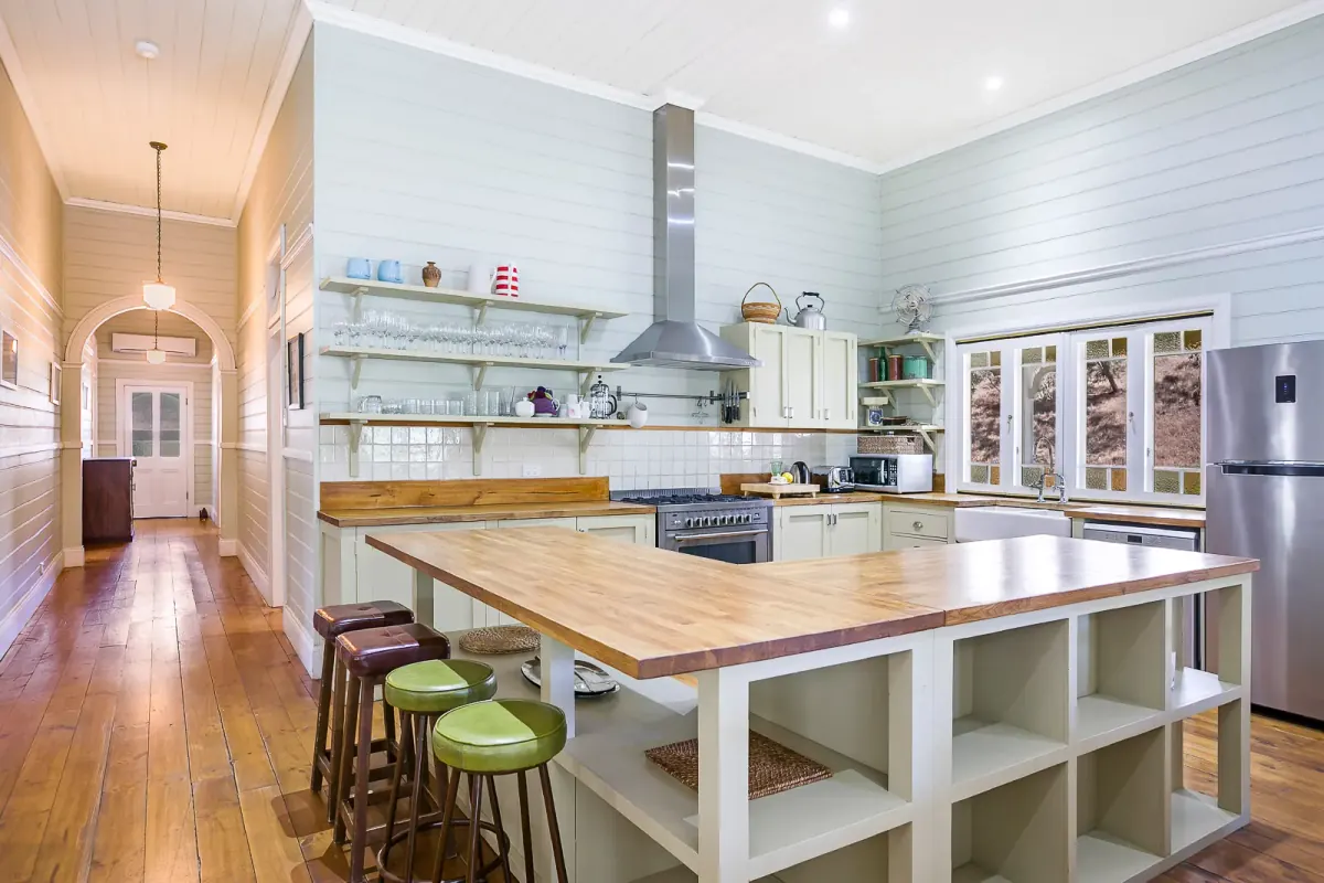 Country kitchen with a timber bench and stools