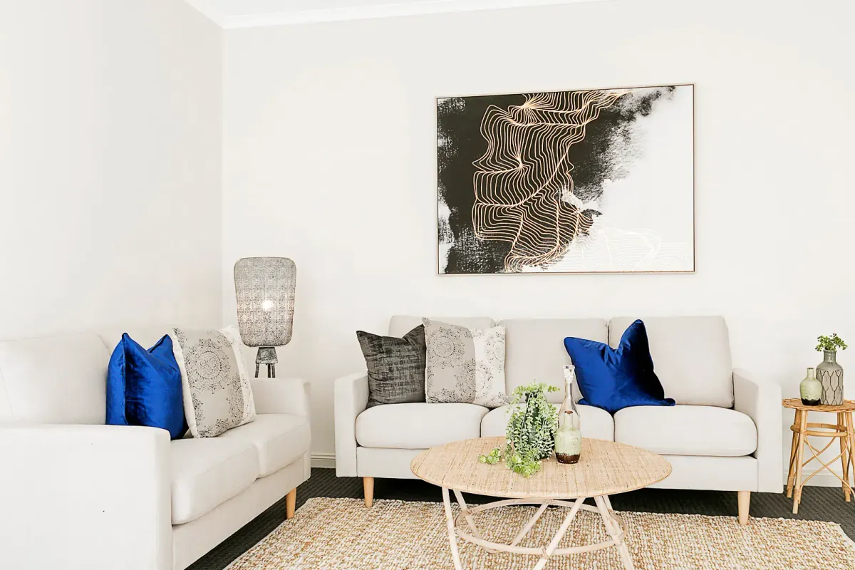 Virtually staged living room, one of the AI extras a studio can resell per listing